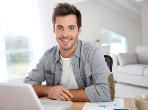 bigstock-Man-working-from-home-with-lap-59076905.jpg